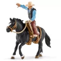 Игровой набор Schleich Ковбой в седле на необъезженной лошади 41416